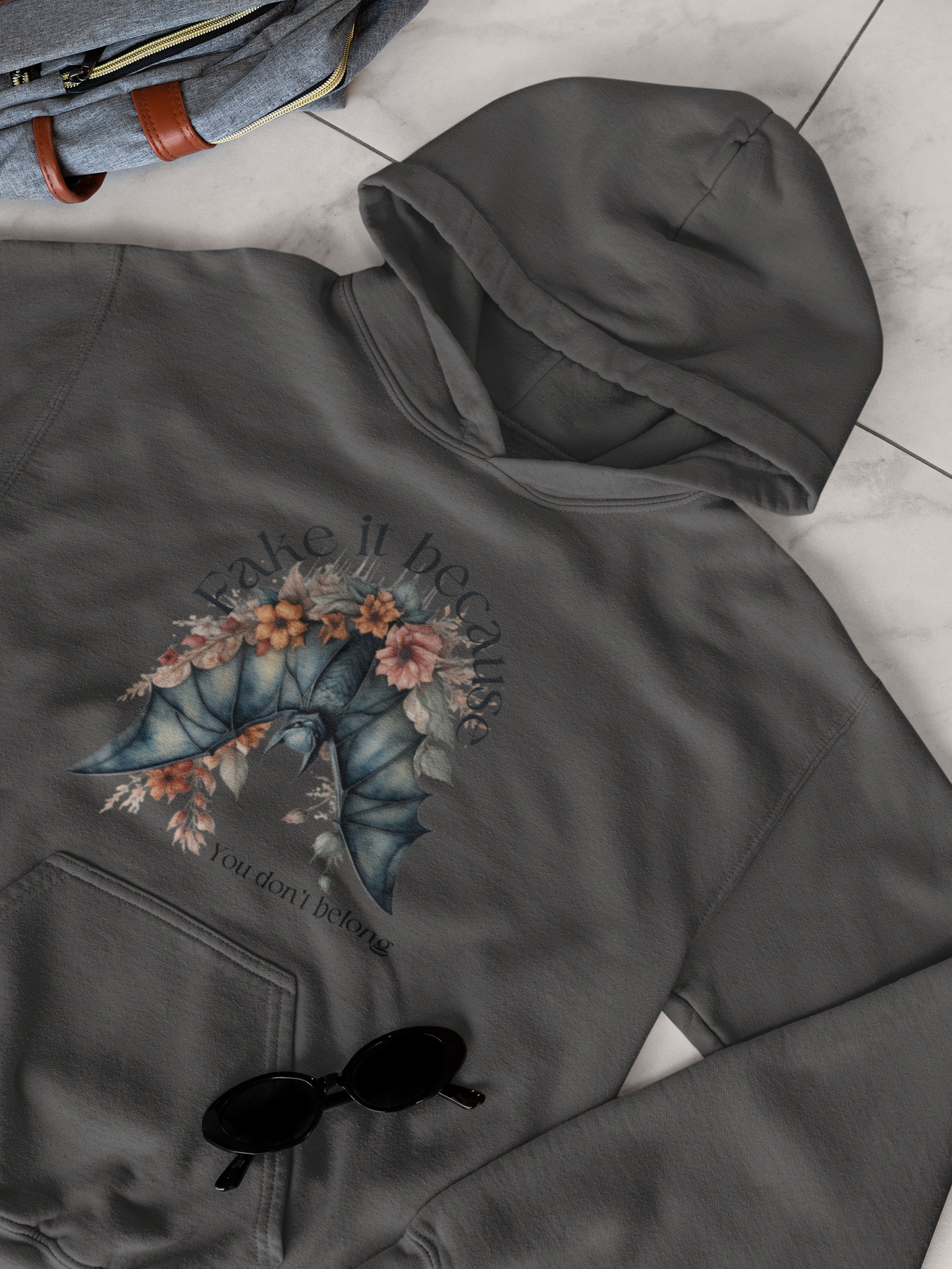 Add some edge to your wardrobe with our Fake it Floral Bats Hooded Sweatshirt - Unisex heavy blend - Stylish and practical for any occasion!